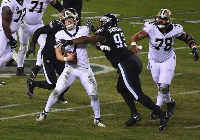 Dec 13, 2020; New Orleans Saints Taysom Hill (7) is tackled by Philadelphia Eagles nose tackle Javon Hargrave (93). Mandatory Credit: James Lang-USA TODAY Sports